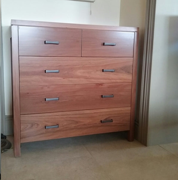 A classic chest of drawers with even drawers and timber knobs Raglan